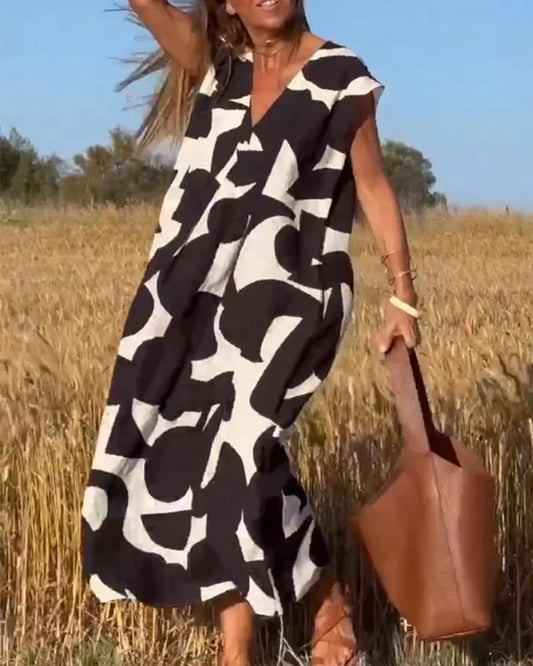 Goldie – Abstract Print Maxi Dress